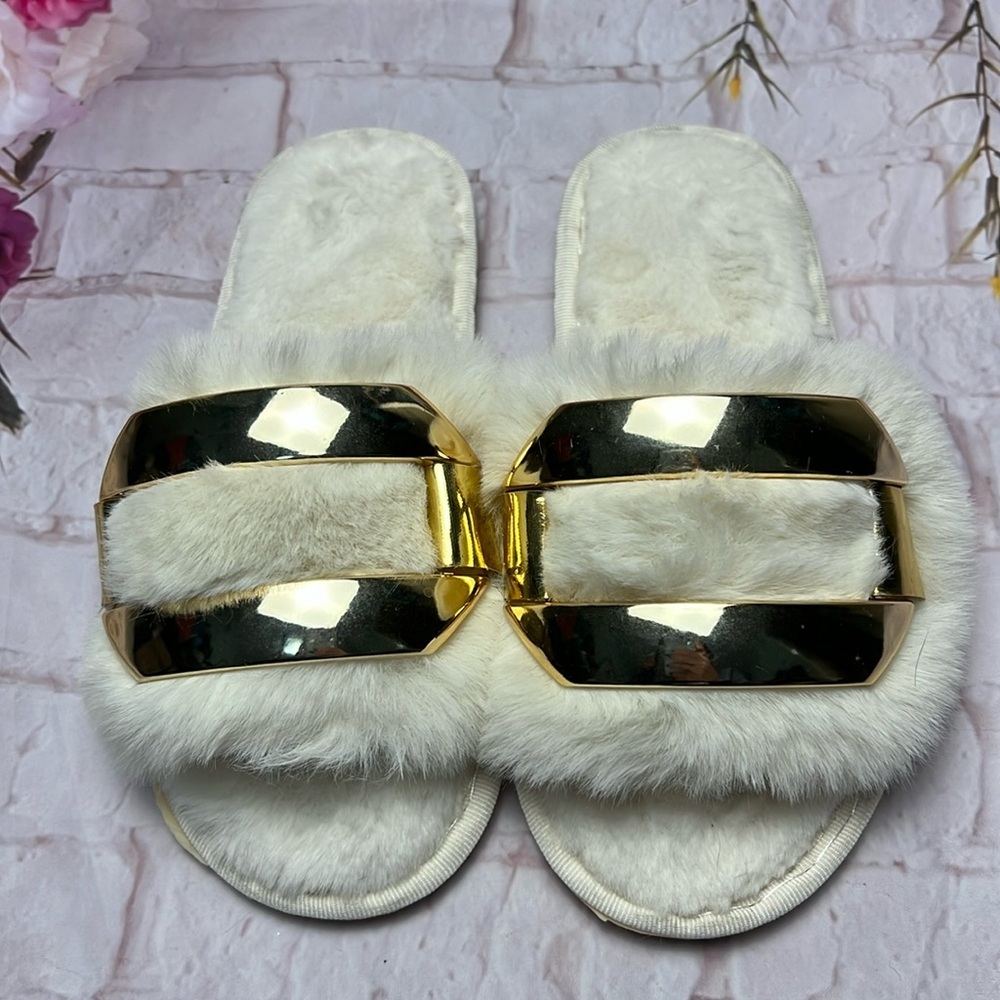 White fur and gold slippers